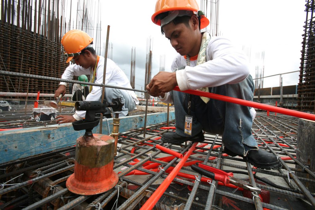 DATEM Incorporated, leading construction company in the Philippines, and their construction crew building one of their premier projects in the country.